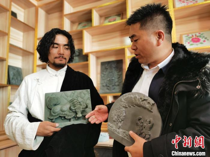 圖為石刻作品展示?！?zhí)砀?攝